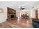 Spacious living room featuring a stone fireplace and wood floors at 6282 41St N Ave, St Petersburg, FL 33709