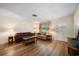 Bright living room with hardwood floors, a front door, and multiple seating arrangements at 6282 41St N Ave, St Petersburg, FL 33709