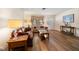 Bright living room with hardwood floors, a large window, and comfortable seating arrangements at 6282 41St N Ave, St Petersburg, FL 33709