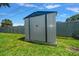 Backyard shed for storage and lawn equipment with mature landscaping at 6282 41St N Ave, St Petersburg, FL 33709