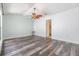 Bright bedroom featuring vaulted ceilings, ceiling fan, and wood flooring at 660 Channing Dr, Palm Harbor, FL 34684