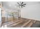 Bright and airy living room with sleek floors, large windows, modern lighting, and an open layout at 660 Channing Dr, Palm Harbor, FL 34684