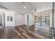 Modern living room boasting sleek floors, access to outdoor space, and an open floor plan at 660 Channing Dr, Palm Harbor, FL 34684