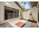 Cozy outdoor patio featuring a decorative brick-and-tile design, perfect for relaxation at 660 Channing Dr, Palm Harbor, FL 34684