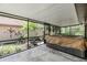 Enclosed patio with adjacent yard, a tranquil retreat at 660 Channing Dr, Palm Harbor, FL 34684