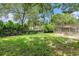 Expansive backyard with a screened lanai and lush surroundings at 7700 Willow Brook Ct, Hudson, FL 34667