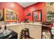 Bathroom with double sinks and a vanity with vibrant red walls for a bold statement at 7700 Willow Brook Ct, Hudson, FL 34667