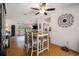 Open dining area features a stylish table, wood floors, and easy access to the kitchen and living room at 7700 Willow Brook Ct, Hudson, FL 34667