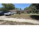Charming one-story home with a two-car garage and mature landscaping in a suburban setting at 7700 Willow Brook Ct, Hudson, FL 34667