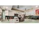Well-lit kitchen with white cabinets, stainless steel appliances, and a functional layout at 7700 Willow Brook Ct, Hudson, FL 34667