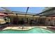 Covered lanai with pool view, perfect for outdoor relaxation at 7700 Willow Brook Ct, Hudson, FL 34667