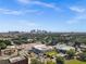 Tampa aerial view featuring the downtown skyline, mature trees, and community pool at 909 E 15Th Ave, Tampa, FL 33605