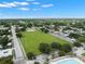Aerial view featuring community park with baseball field surrounded by neighborhood at 909 E 15Th Ave, Tampa, FL 33605