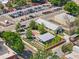 This aerial view features a parking area and a well-maintained landscape with trees and sidewalks at 909 E 15Th Ave, Tampa, FL 33605