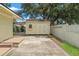 Well-maintained backyard shed with a small window and a secure door at 909 E 15Th Ave, Tampa, FL 33605