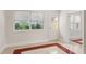 Inviting room with natural light streaming through the windows and a door leading to the outdoors at 909 E 15Th Ave, Tampa, FL 33605