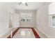 Comfortable bedroom with neutral walls, natural light, and a ceiling fan at 909 E 15Th Ave, Tampa, FL 33605