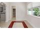 Charming dining area with bright windows and an open doorway to other rooms at 909 E 15Th Ave, Tampa, FL 33605