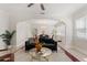 Stylish living room with elegant archway, comfortable seating, and ample natural light at 909 E 15Th Ave, Tampa, FL 33605
