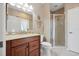Bathroom featuring a vanity with granite countertop and a glass enclosed shower at 9348 Deer Creek Dr, Tampa, FL 33647