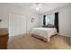 Bedroom with a double bed, white walls, and a large closet at 9348 Deer Creek Dr, Tampa, FL 33647