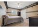 Bedroom with neutral paint, striped accent walls, and built-in shelves at 9348 Deer Creek Dr, Tampa, FL 33647