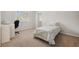 Bedroom with natural light, neutral walls, and minimalist furniture at 9348 Deer Creek Dr, Tampa, FL 33647