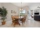 Cozy breakfast nook with natural lighting, chandelier, and view to the backyard at 9348 Deer Creek Dr, Tampa, FL 33647