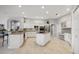 Bright kitchen featuring modern white cabinets, stainless steel appliances, and an island at 9348 Deer Creek Dr, Tampa, FL 33647