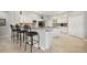 Beautiful kitchen with a bar counter, white cabinets and modern appliances in a spacious layout at 9348 Deer Creek Dr, Tampa, FL 33647