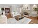 Inviting living room with hardwood floors, fireplace, and stylish furnishings at 9348 Deer Creek Dr, Tampa, FL 33647