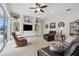 Gathering room with custom entertainment center and carpeted floor at 9348 Deer Creek Dr, Tampa, FL 33647