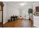 Front room with hardwood floors and large windows at 9348 Deer Creek Dr, Tampa, FL 33647