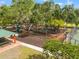 Aerial view of a charming playground with picnic tables and benches in a community at 9348 Deer Creek Dr, Tampa, FL 33647