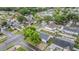 Overhead view of a residential neighborhood, with tree-lined streets and well-kept houses at 10110 Pepperidge Ct, Tampa, FL 33615