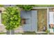 Overhead view of a home with a gray roof, landscaping and a backyard with a white fence at 10110 Pepperidge Ct, Tampa, FL 33615