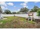 Fenced backyard with grassy area and playset at 10110 Pepperidge Ct, Tampa, FL 33615
