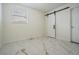 Neutral bedroom featuring marble tile floors, and a black rolling style door at 10110 Pepperidge Ct, Tampa, FL 33615