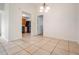 Open dining area with tile flooring leading to kitchen at 10110 Pepperidge Ct, Tampa, FL 33615