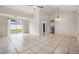 Bright open living space with fan and sliding glass doors at 10110 Pepperidge Ct, Tampa, FL 33615