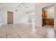 Open concept living space and dining room with tile flooring at 10110 Pepperidge Ct, Tampa, FL 33615