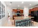 Spacious kitchen with a large island, dark wood cabinets and bar stool seating at 10512 Fuzzy Cattail St, Riverview, FL 33578