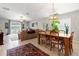 Bright living room with view to patio, ceiling fan, dining area and comfortable seating at 10512 Fuzzy Cattail St, Riverview, FL 33578