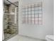 Updated bathroom features a tiled shower with glass block window at 107 Halton Cir, Seffner, FL 33584