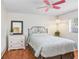 Charming bedroom with decorative bed frame and a pink ceiling fan at 107 Halton Cir, Seffner, FL 33584