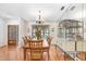 A beautifully staged dining room with wood floors, a chandelier, and a large buffet at 107 Halton Cir, Seffner, FL 33584