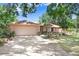 Inviting single-Gathering home with a two-car garage and a long driveway, complemented by well-maintained landscaping at 107 Halton Cir, Seffner, FL 33584