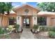 Inviting front entrance with decorative glass door and manicured landscaping at 107 Halton Cir, Seffner, FL 33584