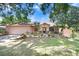 Charming single-story home with a well-manicured lawn and mature landscaping at 107 Halton Cir, Seffner, FL 33584