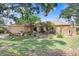 Attractive single-level home featuring a two-car garage, a neatly landscaped front yard, and a welcoming entrance at 107 Halton Cir, Seffner, FL 33584